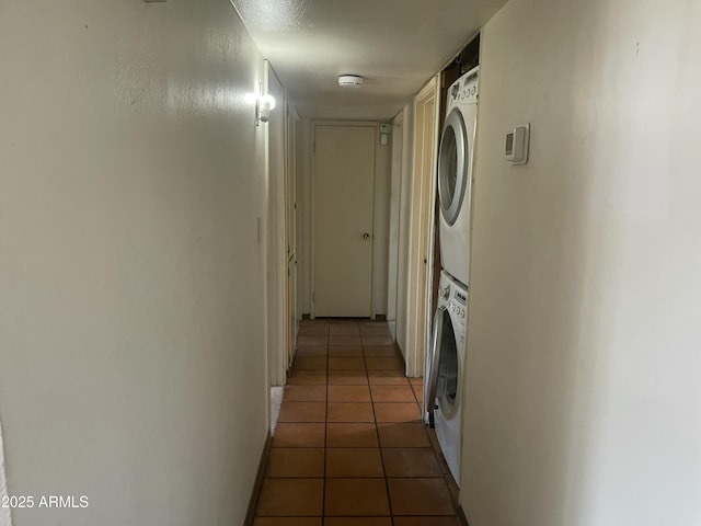 1529 W Eva St, Phoenix, AZ 85021 - corridor featuring stacked washer and dryer, baseboards, and light tile patterned floors