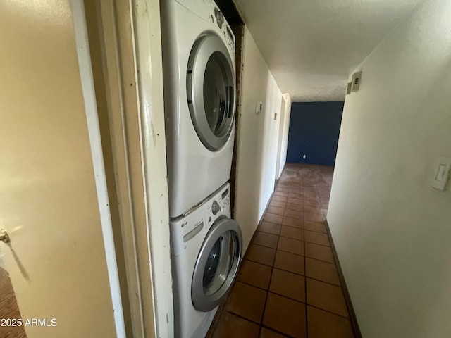 1529 W Eva St, Phoenix, AZ 85021 - washroom with tile patterned flooring, laundry area, and stacked washer / dryer