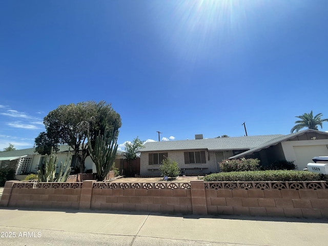 1529 W Eva St, Phoenix, AZ 85021 - ranch-style home with brick siding, a garage, and a fenced front yard