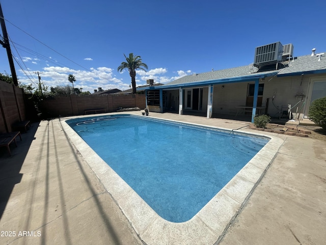 1529 W Eva St, Phoenix, AZ 85021 - view of swimming pool featuring a fenced in pool, a fenced backyard, central AC, and a patio