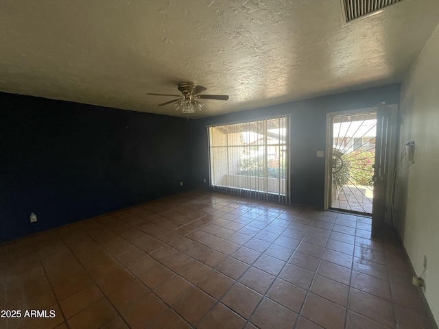1529 W Eva St, Phoenix, AZ 85021 - tiled empty room with plenty of natural light, a ceiling fan, a textured ceiling, and visible vents