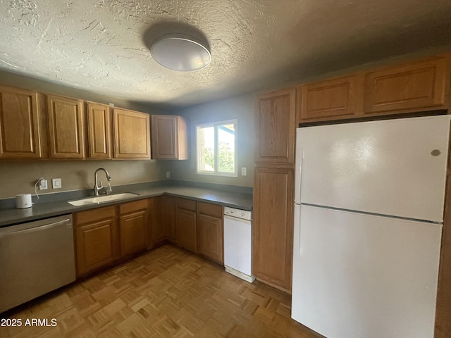 1529 W Eva St, Phoenix, AZ 85021 - kitchen featuring a sink, brown cabinetry, white appliances, and a textured ceiling