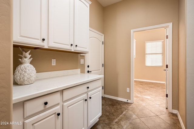 laundry room featuring light tile patterned flooring