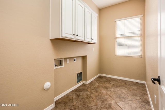 laundry area featuring cabinets, washer hookup, and hookup for an electric dryer