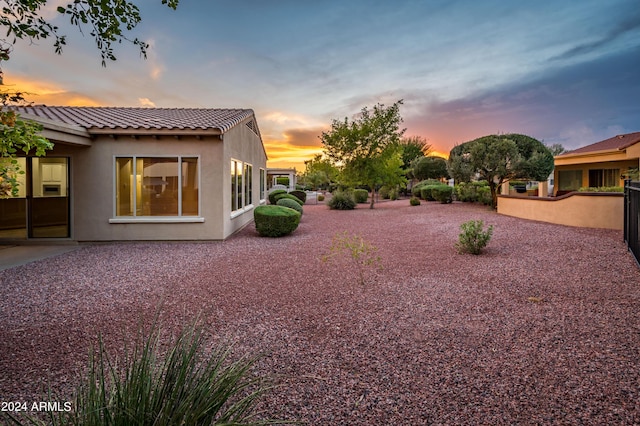 yard at dusk with a patio