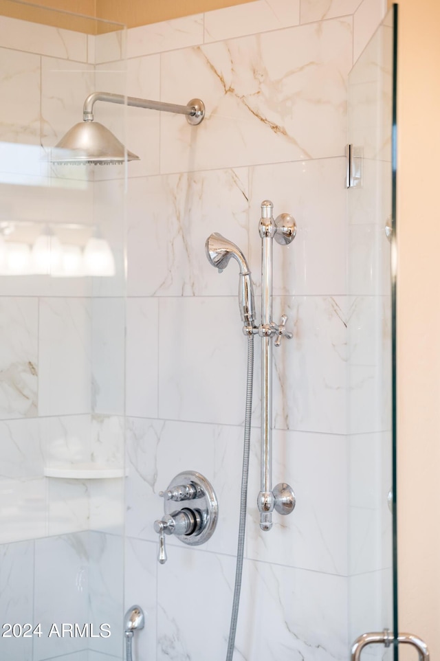 bathroom with a tile shower