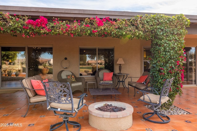 view of patio / terrace with a fire pit