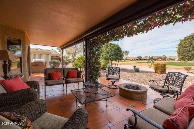 view of patio with a pergola and an outdoor living space with a fire pit