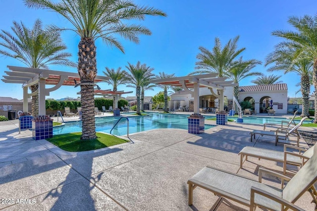 view of swimming pool with a patio area and a pergola