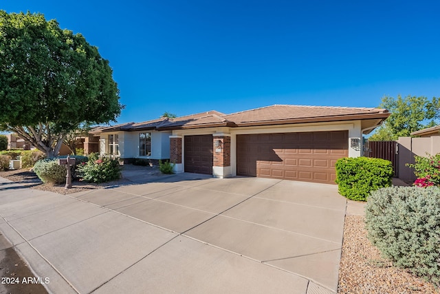 ranch-style home featuring a garage