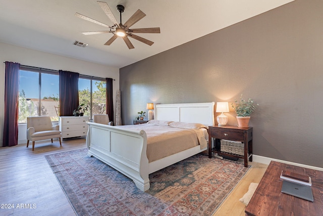 bedroom with ceiling fan and hardwood / wood-style floors