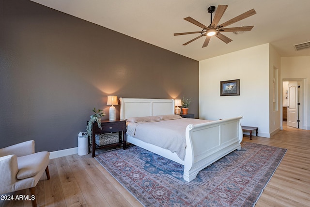 bedroom with light hardwood / wood-style flooring and ceiling fan