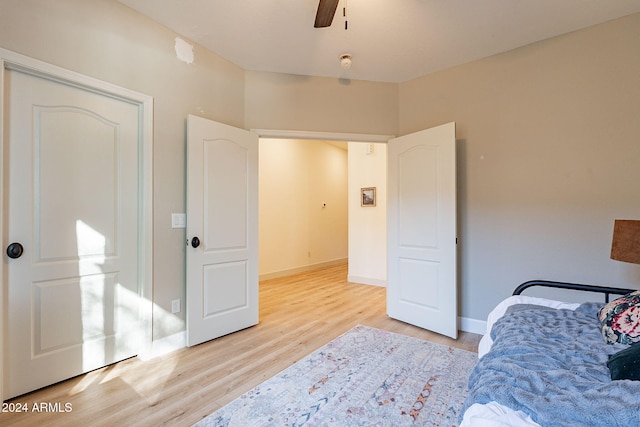 bedroom featuring light wood-type flooring and ceiling fan