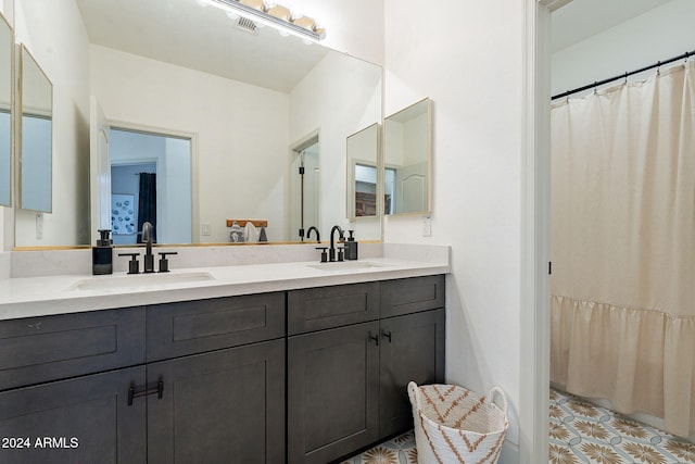 bathroom featuring vanity and a shower with shower curtain