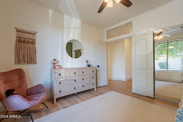 bedroom with light hardwood / wood-style flooring and ceiling fan