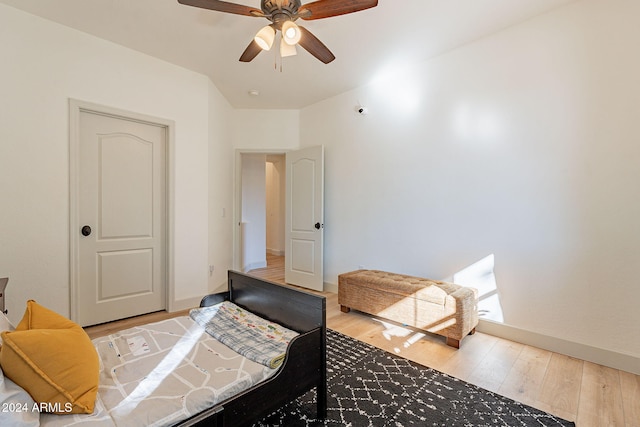 bedroom with hardwood / wood-style flooring and ceiling fan