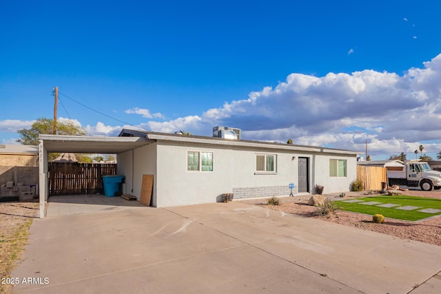 view of front of home featuring a carport