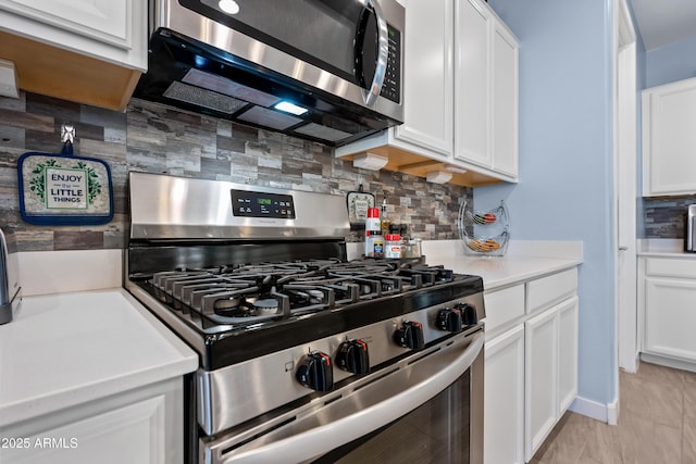 kitchen featuring backsplash, white cabinetry, and stainless steel appliances