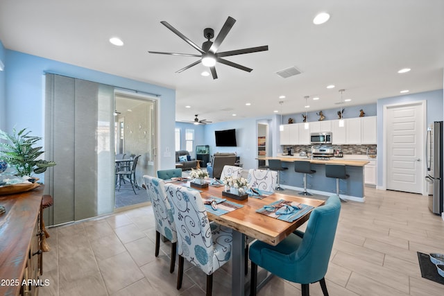 dining space with ceiling fan