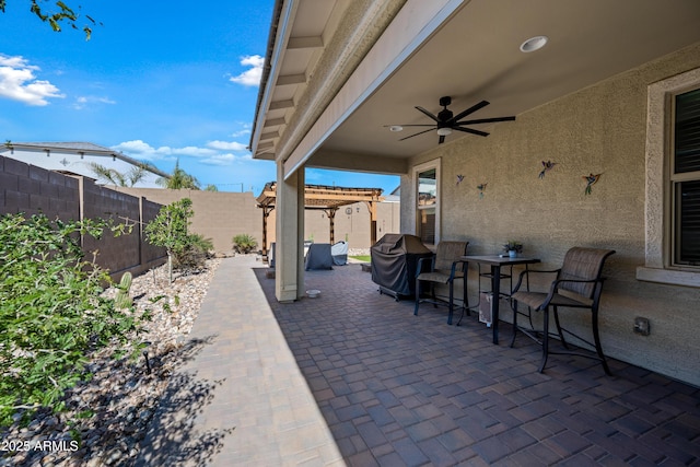 view of patio / terrace featuring a pergola, grilling area, and ceiling fan