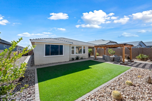 back of house with a pergola, a patio area, and a lawn