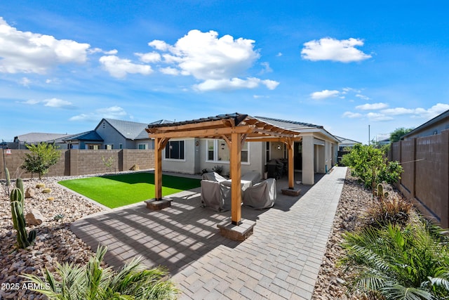 back of house with a pergola and a patio area