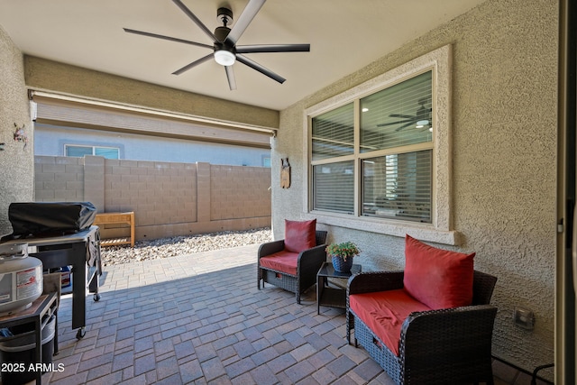 view of patio / terrace featuring ceiling fan