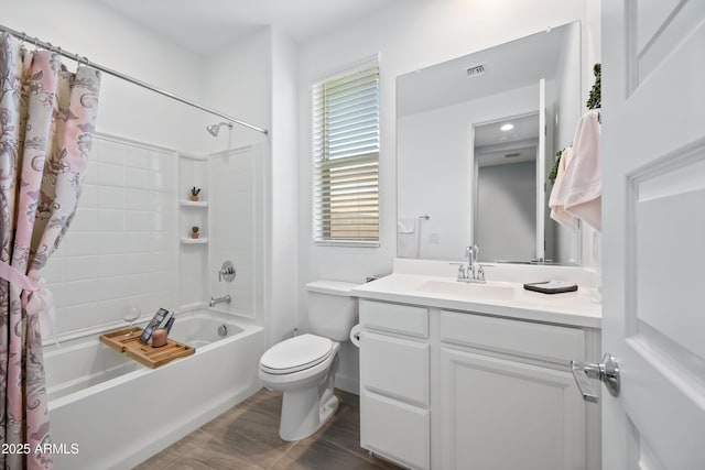 full bathroom with vanity, toilet, and shower / tub combo with curtain