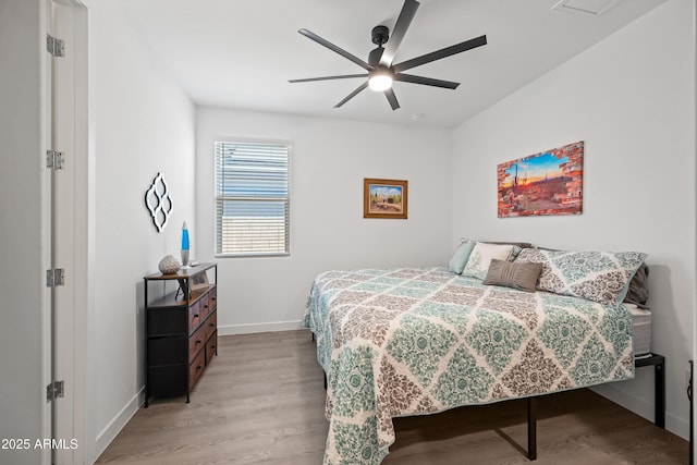 bedroom featuring ceiling fan and light hardwood / wood-style flooring