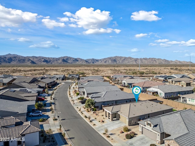 birds eye view of property with a mountain view