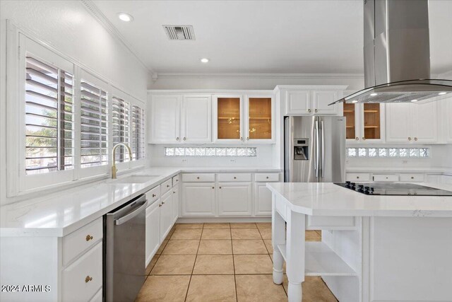 kitchen featuring sink, white cabinetry, island range hood, stainless steel appliances, and crown molding