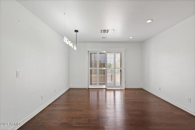 empty room featuring dark hardwood / wood-style flooring