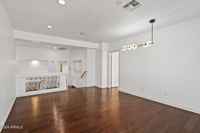 empty room with hardwood / wood-style flooring