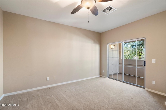 carpeted empty room with ceiling fan