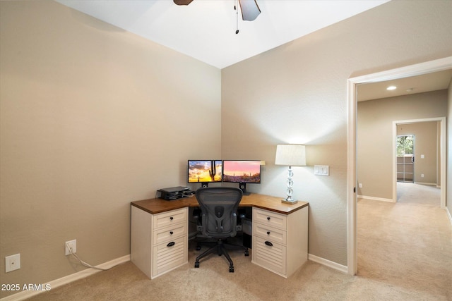 carpeted office with ceiling fan