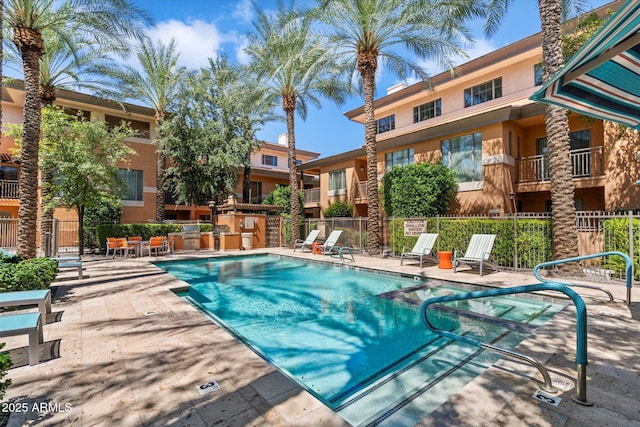 view of swimming pool featuring a patio area