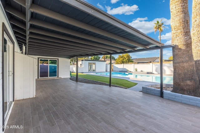 view of patio featuring a fenced in pool