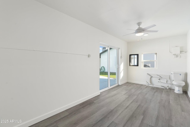 interior space with light hardwood / wood-style flooring and ceiling fan