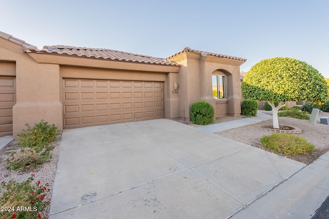 mediterranean / spanish-style house featuring a garage