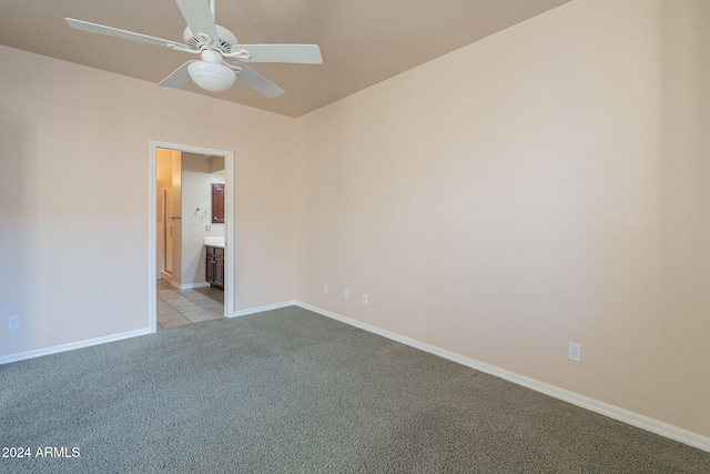 spare room with light carpet and ceiling fan