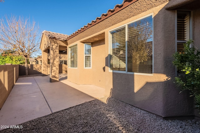 view of home's exterior with a patio area