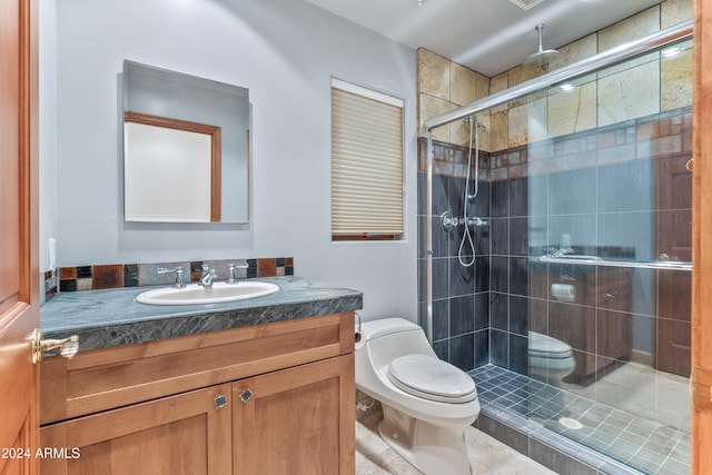 bathroom with vanity, toilet, and walk in shower