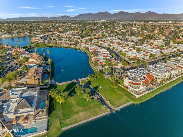 birds eye view of property featuring a water and mountain view