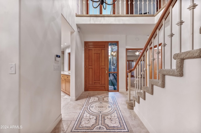 foyer with a towering ceiling