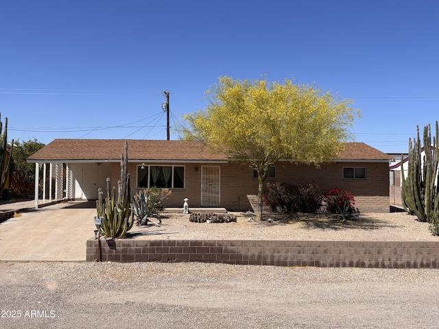520 W Rocalla Ave, Ajo, AZ 85321 - single story home with an attached carport, driveway, and a shingled roof