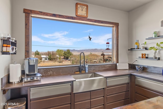 10975 E Janet Way, Dewey, AZ 86327 - kitchen featuring plenty of natural light, a sink, a mountain view, and gray cabinetry