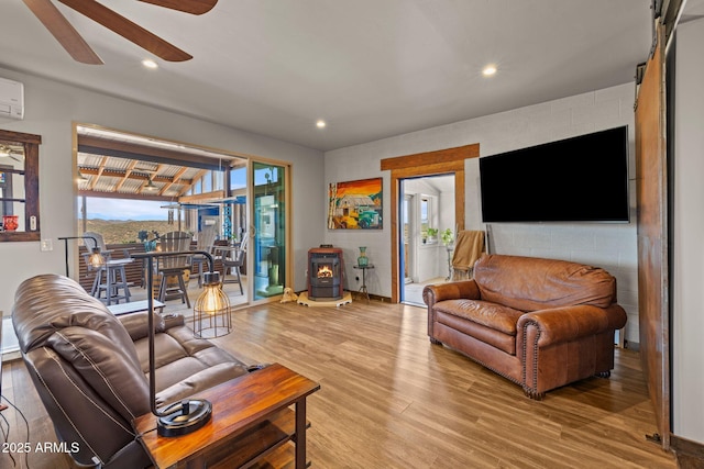 10975 E Janet Way, Dewey, AZ 86327 - living room featuring recessed lighting, ceiling fan, wood finished floors, and a wood stove