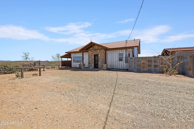 10975 E Janet Way, Dewey, AZ 86327 - view of front of property with board and batten siding, fence, and stone siding
