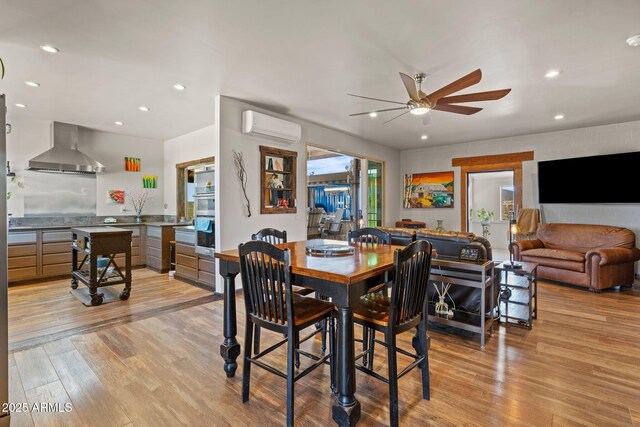 10975 E Janet Way, Dewey, AZ 86327 - dining room with recessed lighting, a wall mounted air conditioner, light wood-style flooring, and a ceiling fan