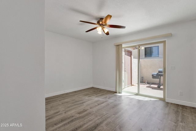 13636 N Hamilton Dr Unit 101, Fountain Hills, AZ 85268 - spare room with baseboards, a ceiling fan, and wood finished floors